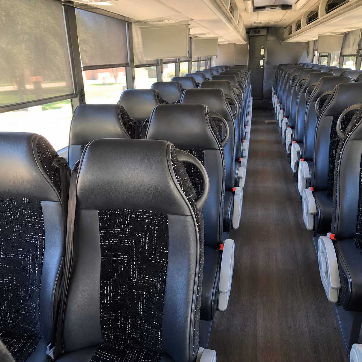 charter buses ready for the drive to ann arbor east lansing and every michigan campus